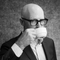 Matthew Miller sipping a coffee.