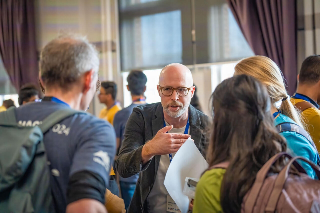 Matthew Miller coaching and encouraging participants at the 2024 Code Hack hackathon at the Royal Jubilee Hospital Matthew Miller coaching and encouraging participants at the 2024 Code Hack hackathon at the Royal Jubilee Hospital